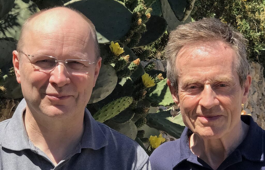 Anssi Kartunnen & John Paul Jones posing in front of a prickly pear cactus in New Mexico